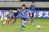 Japan's Yuya Osako, center, scores a goal on penalty kick against Myanmar during their Asian qualification soccer match for the FIFA World Cup Qatar 2022 at Fukuda Denshi Arena in Chiba, east of Tokyo, Friday, May 28, 2021.(Kyodo News via AP)