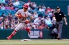 St. Louis Cardinals' Tyler O'Neill (27) sprints around the bases after hitting a two-run home run against the Arizona Diamondbacks as umpire Mike Estabrook, right, looks on during the first inning of a baseball game Friday, May 28, 2021, in Phoenix. (AP Photo/Ross D. Franklin)