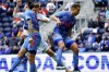 New England Revolution forward Adam Buksa, center, heads on goal as FC Cincinnati defender Geoff Cameronnati midfielder Caleb Stanko, right, defend during the first half of an MLS soccer match, Saturday, May 29, 2021, at TQL Stadium in Cincinnati. (Kareem Elgazzar/The Cincinnati Enquirer via AP)