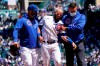 Chicago Cubs' David Bote, center, leaves with a team trainer and manager David Ross, left, after an injury during the fourth inning of a baseball game against the Cincinnati Reds in Chicago, Saturday, May 29, 2021. (AP Photo/Nam Y. Huh)