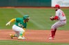 Oakland Athletics' Tony Kemp, left, reacts as Los Angeles Angels shortstop David Fletcher approaches to tag him out during the fourth inning of a baseball game in Oakland, Calif., Saturday, May 29, 2021. (AP Photo/Jeff Chiu)