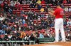 Fans watch as Boston Red Sox's Nathan Eovaldi, foreground, pitches during the first inning of a baseball game against the Miami Marlins, Saturday, May 29, 2021, in Boston. Saturday marks the end of most COVID-19 restrictions in Massachusetts. (AP Photo/Michael Dwyer)