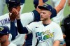 Tampa Bay Rays' Austin Meadows high fives teammates after they defeated the Philadelphia Phillies during a baseball game Saturday, May 29, 2021, in St. Petersburg, Fla. (AP Photo/Chris O'Meara)
