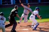 San Francisco Giants' Mike Yastrzemski, second from right, scores on an error after Evan Longoria hit a single as Los Angeles Dodgers catcher Will Smith, right, waits for the ball as home plate umpire Manny Gonzalez, second from left, and Wilmer Flores watch during the fourth inning of a baseball game Saturday, May 29, 2021, in Los Angeles. (AP Photo/Mark J. Terrill)