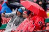Jazmin Lopez, left, takes a selfie that includes her wife, Glenda Lopez, second from left, both of Fitchburg, Mass., while waiting for the start of a baseball game between the Miami Marlins and the Boston Red Sox, Sunday, May 30, 2021, in Boston. Sunday's game was postponed due to weather. (AP Photo/Steven Senne)