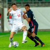 Switzerland's Steven Zuber, left, fights for the ball against USA's Reggie Cannon, right, during a friendly soccer match between Switzerland and the USA, at the Kybunpark stadium in St. Gallen, Switzerland, on Sunday, May 30, 2021. (Georgios Kefalas/Keystone via AP)
