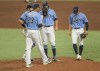 Tampa Bay Rays pitching coach Kyle Snyder (23) walks up the mound to talk with catcher Mike Zunino, left, pitcher Josh Fleming and Taylor Walls, right, during the fifth inning of a baseball game against the Philadelphia Phillies Sunday, May 30, 2021, in St. Petersburg, Fla. (AP Photo/Steve Nesius)