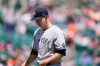 New York Yankees starting pitcher Michael King walks to the dugout after being relieved during the third inning of a baseball game against the Detroit Tigers, Sunday, May 30, 2021, in Detroit. (AP Photo/Carlos Osorio)