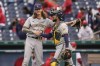 Milwaukee Brewers relief pitcher Josh Hader, left, and catcher Omar Narvaez react after defeating the Washington Nationals 3-0 during a baseball game, Sunday, May 30, 2021, in Washington. (AP Photo/Julio Cortez)
