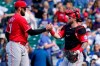 Cincinnati Reds relief pitcher Tejay Antone, left, celebrates with catcher Tucker Barnhart after they defeated the Chicago Cubs in a baseball game in Chicago, Sunday, May 30, 2021. (AP Photo/Nam Y. Huh)