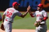 Los Angeles Angels pitcher Raisel Iglesias (32) celebrates with shortstop David Fletcher (22) after the Angels defeated the Oakland Athletics in a baseball game in Oakland, Calif., Sunday, May 30, 2021. (AP Photo/Jeff Chiu)