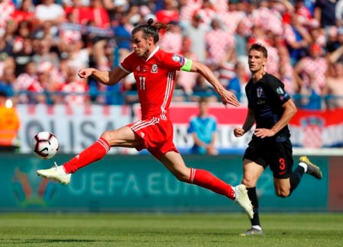 FILE - In this Saturday, June 8, 2019 filer, Wales' Gareth Bale goes for the ball during the Euro 2020 group E qualifying soccer match between Croatia and Wales at the Gradski Vrt stadium in Osijek, Croatia. (AP Photo/Darko Bandic, File)