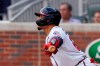 Atlanta Braves' William Contreras follows through on a two-run single in the first inning of a baseball against the Washington Nationals, Monday, May 31, 2021, in Atlanta. (AP Photo/John Bazemore)