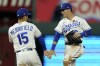 Kansas City Royals' Whit Merrifield (15) and Andrew Benintendi celebrate after their baseball game against the Pittsburgh Pirates Monday, May 31, 2021, in Kansas City, Mo. Kansas City won 7-3. (AP Photo/Charlie Riedel)