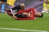 Manchester United's Mason Greenwood grimaces after an injury during the Europa League final soccer match between Manchester United and Villarreal in Gdansk, Poland, Wednesday May 26, 2021. (Adam Warzawa, Pool via AP)