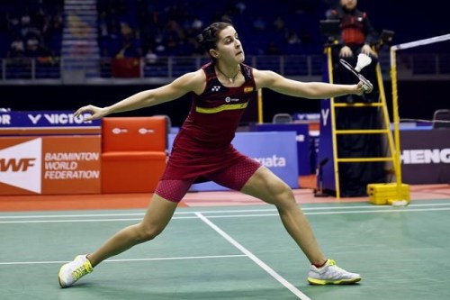 FILE - In this Saturday, Jan. 20, 2018 file photo, Carolina Marin of Spain returns a shot to Tai Tzu-ying of Taiwan during the semifinal round of the women's singles match in the 2018 Malaysia Masters badminton tournament in Kuala Lumpur, Malaysia. Spanish Olympic badminton champion Marin said Tuesday, June 1, 2021 she will not defend her title at the Tokyo Games because of a knee injury. (AP Photo/Sadiq Asyraf, file)
