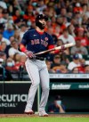 Boston Red Sox Marwin Gonzalez (12) reacts after striking out against Houston Astros starting pitcher Jose Urquidy during the third inning of a baseball game in Houston, Monday, May 31, 2021. (Karen Warren/Houston Chronicle via AP)