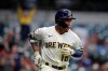 Milwaukee Brewers' Kolten Wong watches his two-run home run during the third inning of a baseball game against the Detroit Tigers Tuesday, June 1, 2021, in Milwaukee. (AP Photo/Aaron Gash)
