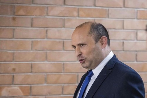 Yemina party leader Naftali Bennett arrives to speaks to the Israeli Parliament in Jerusalem, Sunday, May 30, 2021. (Yonatan Sindel/Pool via AP)