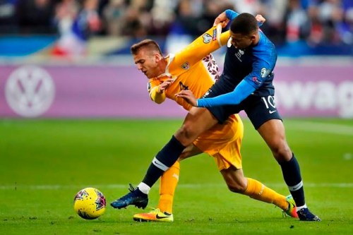 FILE - In this Thursday, Nov. 14, 2019 filer, France's Kylian Mbappe, right, fights for the ball with Moldova's Sergiu Platica, during the Euro 2020 group H qualifying soccer match between France and Moldova at the Stade de France stadium, in Saint Denis, north of Paris. (AP Photo/Francois Mori, File)