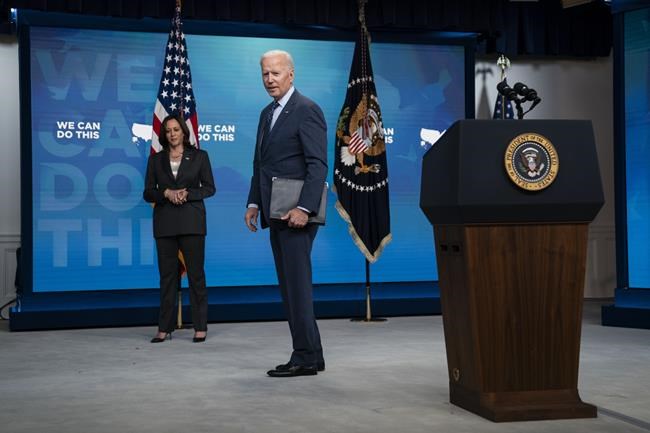 Vice President Kamala Harris listens as President Joe Biden answers a question after speaking about the COVID-19 vaccination program, in the South Court Auditorium on the White House campus, Wednesday, June 2, 2021, in Washington. (AP Photo/Evan Vucci)