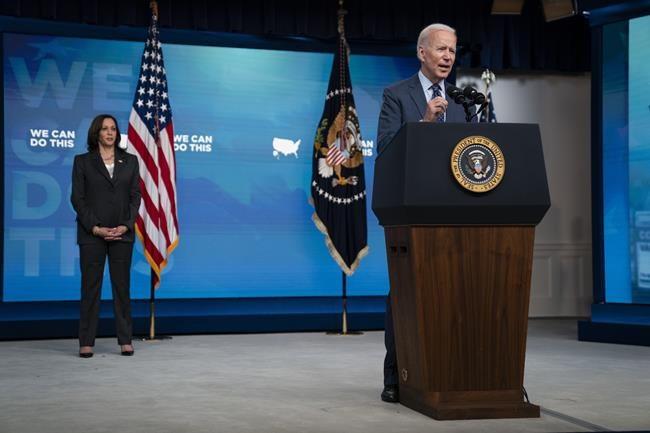 Vice President Kamala Harris listens as President Joe Biden speaks about the COVID-10 vaccination program, in the South Court Auditorium on the White House campus, Wednesday, June 2, 2021, in Washington. (AP Photo/Evan Vucci)