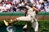 San Diego Padres' Ha-Seong Kim, foreground, and Tommy Pham collide going after a fly ball hit by Chicago Cubs' P.J. Higgins in the fourth inning of a baseball game Wednesday, June 2, 2021, in Chicago. (AP Photo/Charles Rex Arbogast)
