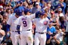 Chicago Cubs' Javier Baez (9) points to the fans as he celebrates his two-run home run off San Diego Padres relief pitcher Miguel Diaz with Anthony Rizzo, left, and Ian Happ in the seventh inning of a baseball game Wednesday, June 2, 2021, in Chicago. (AP Photo/Charles Rex Arbogast)