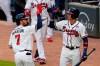 Atlanta Braves' Dansby Swanson (7) celebrates with Ehire Adrianza after hitting a home run in the third inning of the team's baseball game against the Washington Nationals on Wednesday, June 2, 2021, in Atlanta. (AP Photo/John Bazemore)