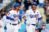 Los Angeles Dodgers' Cody Bellinger, right, smiles next to Justin Turner after Bellinger's grand slam against the St. Louis Cardinals during the first inning of a baseball game Wednesday, June 2, 2021, in Los Angeles. (AP Photo/Marcio Jose Sanchez)