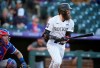 Colorado Rockies' Charlie Blackmon breaks from the batter's box after singling off Texas Rangers starting pitcher Jordan Lyles during the second inning of a baseball game Wednesday, June 2, 2021, in Denver. (AP Photo/David Zalubowski)