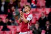 Arsenal's Martin Odegaard applauds the fans as he is substituted off during the English Premier League soccer match between Arsenal and Brighton & Hove Albion at Emirates Stadium in London, England, Sunday, May 23, 2021. (AP Photo/Alastair Grant, Pool)
