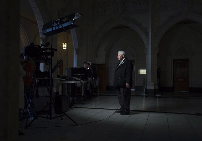 Senator Murray Sinclair takes part in a television interview in the foyer of the House of Commons on April 12, 2016 in Ottawa. THE CANADIAN PRESS/Adrian Wyld