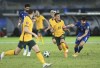 Kuwait's Khaled Ibrahim, right, fights for the ball with Australia's Chris Ikonomidis during the World Cup 2022 Group B qualifying soccer match between Kuwait and Australia in Kuwait City, Kuwait, Thursday, June 3, 2021. (AP Photo/Jaber Abdulkhaleg)