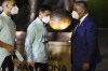 Argentina's Lionel Messi, center, and Argentine Football Association, (AFA) President Claudio Tapia attend the unveiling of a Diego Maradona statue outside Madre de Ciudades stadium prior to a qualifying soccer match for the FIFA World Cup Qatar 2022 between Argentina and Chile in Santiago del Estero, Argentina, Thursday, June 3, 2021. (Agustin Marcarian, Pool via AP)