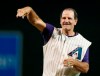 FILE - In this Aug. 30, 2014, file photo, Former Arizona Diamondbacks manager Bob Brenly throws out the first pitch before the team's baseball game against the Colorado Rockies in Phoenix. Brenly, now a Diamondbacks broadcaster, is stepping away from the booth over the next week after facing backlash for an on-air comment about New York Mets pitcher Marcus Stroman's headwear. (AP Photo/Rick Scuteri, File)