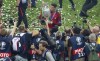 FILE - In this Sunday, July 10, 2016 file photo, Portugal's Cristiano Ronaldo celebrates with the trophy after winning the Euro 2016 final soccer match between Portugal and France at the Stade de France in Saint-Denis, north of Paris. When it comes time for Brazilians to choose who to watch on the soccer field this month — Neymar or Kylian Mbappé, Lionel Messi or Cristiano Ronaldo — the response might be surprising. Because of an unusual set of circumstances, it will be the European Championship that reaches more viewers in Brazil than the Copa America — even though Brazil is expected to host South American the tournament under a completely different set of unusual circumstances. (AP Photo/Thibault Camus, File)