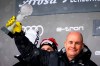 FILE - In this Sunday, March 21, 2021 file photo Johan Eliasch, Chairman of the Management Board of the HEAD group celebrates on the podium at the FIS Alpine Skiing World Cup finals, in Parpan-Lenzerheide, Switzerland. Billionaire businessman Johan Eliasch has been elected president of the International Ski Federation. The CEO of ski and tennis brand Head was one of four candidates and follows long time president Gian Franco Kasper. (Jean-Christophe Bott/Keystone via AP, file)