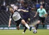 Fulham's Tim Ream, left, and Newcastle United's Allan Saint-Maximin battle for the ball during the English Premier League soccer match at Craven Cottage, London, Sunday May 23, 2021. (Matthew Childs/Pool via AP)
