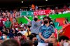 Soccer fans who have been allowed into the ground, watch the international friendly soccer match between Spain and Portugal at the Wanda Metropolitano stadium in Madrid, Spain on Friday June 4, 2021. (AP Photo/Manu Fernandez)
