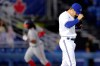 Toronto Blue Jays relief pitcher Ty Tice reacts after giving up a two-run home run to Washington Nationals' Josh Bell, rounding the bases in the background, during fifth inning MLB baseball action in Dunedin, Fla., Wednesday, April 28, 2021. The Toronto Blue Jays traded right-hander Ty Tice to the Atlanta Braves on Friday in exchange for cash considerations. THE CANADIAN PRESS/AP-Mike Carlson