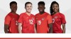Canadian soccer players Jonathan David, left to right, Christine Sinclair, Alphonso Davies and Ashley Lawrence wear their new Canada jerseys in this undated handout photo. THE CANADIAN PRESS/HO, Canada Soccer *MANDATORY CREDIT*