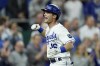 Kansas City Royals' Andrew Benintendi celebrates after hitting a grand slam during the fifth inning of a baseball game against the Pittsburgh Pirates Tuesday, June 1, 2021, in Kansas City, Mo. (AP Photo/Charlie Riedel)
