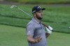 Jon Rahm watches his shot to the ninth green as he walks down the fairway during the second round of the Memorial golf tournament, Friday, June 4, 2021, in Dublin, Ohio. (AP Photo/Darron Cummings)