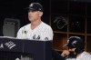 New York Yankees third base coach Phil Nevin, left, watches the eighth inning of a baseball game against the Boston Red Sox, Friday, June 4, 2021, in New York. (AP Photo/Frank Franklin II)