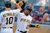 Pittsburgh Pirates' Ke'Bryan Hayes (13) celebrates with Bryan Reynolds as he returns to the dugout after hitting a two-run home run off Miami Marlins starting pitcher Cody Poteet during the first inning of a baseball game in Pittsburgh, Friday, June 4, 2021. (AP Photo/Gene J. Puskar)