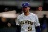 Milwaukee Brewers' Freddy Peralta walks to the dugout after the sixth inning of a baseball game against the Arizona Diamondbacks, Friday, June 4, 2021, in Milwaukee. (AP Photo/Aaron Gash)