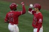 Los Angeles Angels' Justin Upton (10) celebrates with Shohei Ohtani (17) after hitting a home run during the third inning of a baseball game against the Seattle Mariners Friday, June 4, 2021, in Anaheim, Calif. David Fletcher also scored. (AP Photo/Ashley Landis)