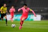 South Korea's Son Heung-min dribbles the ball against Turkmenistan during their Asian zone Group H qualifying soccer match for the FIFA World Cup Qatar 2022 at Goyang stadium in Goyang, South Korea, Saturday, June 5, 2021. (AP Photo/Lee Jin-man)