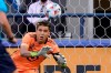 Minnesota United goalkeeper Dayne St. Clair dives to make a stop on a shot by Seattle Sounders defender Xavier Arreaga (not shown) during the first half of an MLS soccer match, Friday, April 16, 2021, in Seattle. THE CANADIAN PRESS/AP, Ted S. Warren